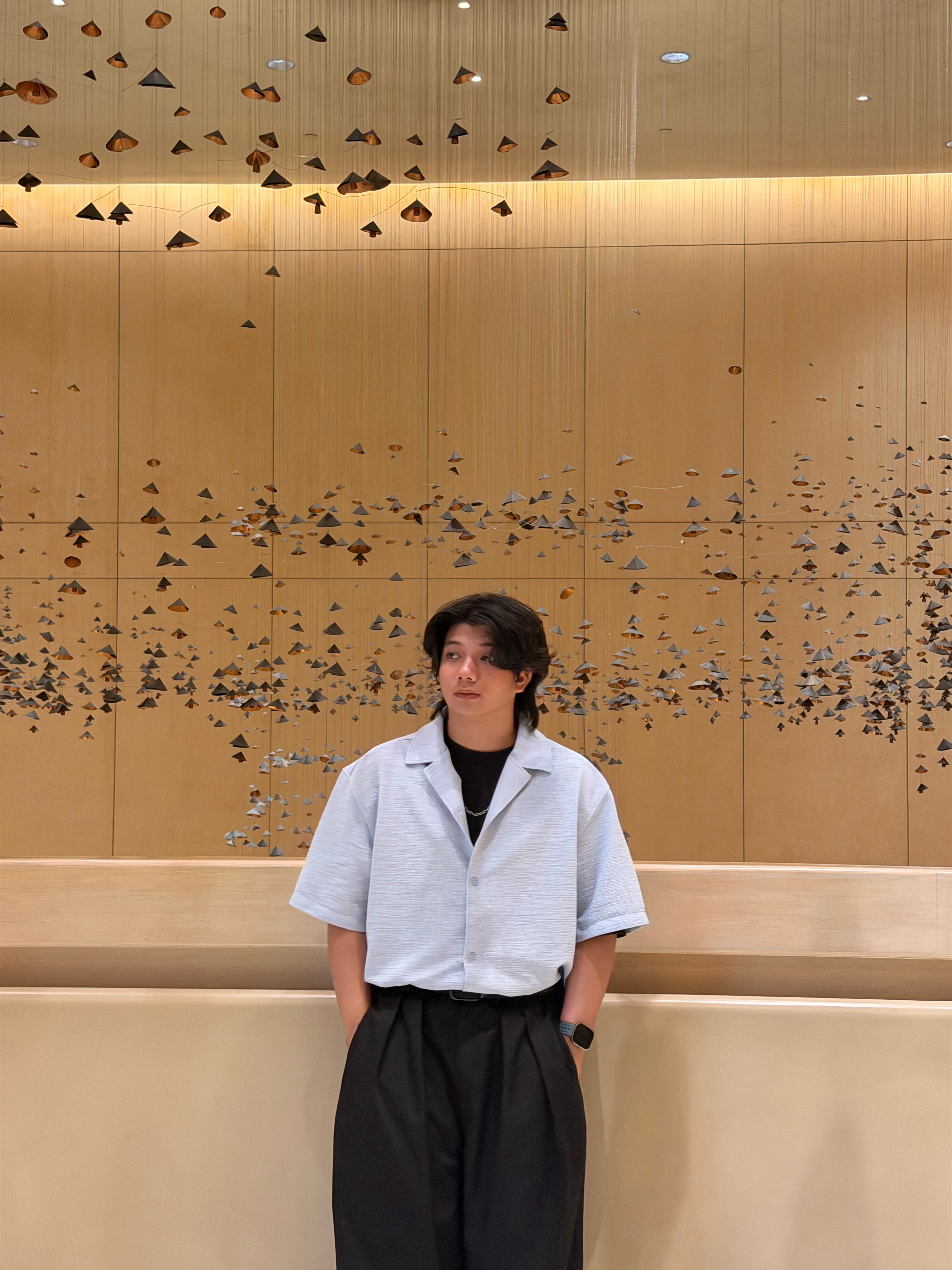 Portrait of Sorlahuddin Chuaykarn below an installation ceiling.
